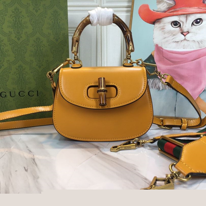 G*u*i top handle bags